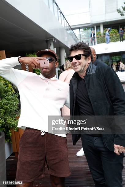 Tyler, The Creator", aka Tyler Okonma and Patrick Bruel attend the 2019 French Tennis Open - Day Fourteen at Roland Garros on June 08, 2019 in Paris,...