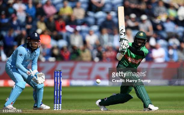 Shakib Al Hasan of Bangladesh plays a shot as Jonny Bairstow of England looks on during the Group Stage match of the ICC Cricket World Cup 2019...