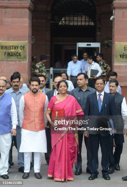 Indian Finance Minister Nirmala Sitharaman and Junior Finance Minister Anurag Thakur clicked outside the Parliament to unveil the annual federal...