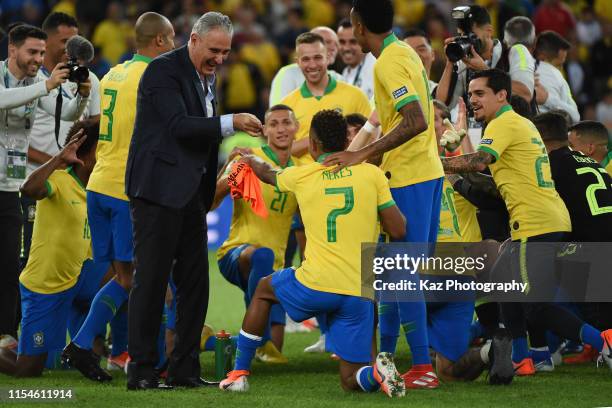 Adenor Bachi, manager of Brasil enjoy the win with Dabvid Neres of Brasil during the Copa America Brazil 2019 Final match between Brazil and Peru at...