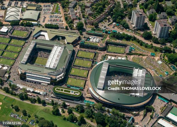 An aerial photograph taken from a helicopter shows a general view of The All England Lawn Tennis Club in Wimbledon, southwest London, on the fourth...