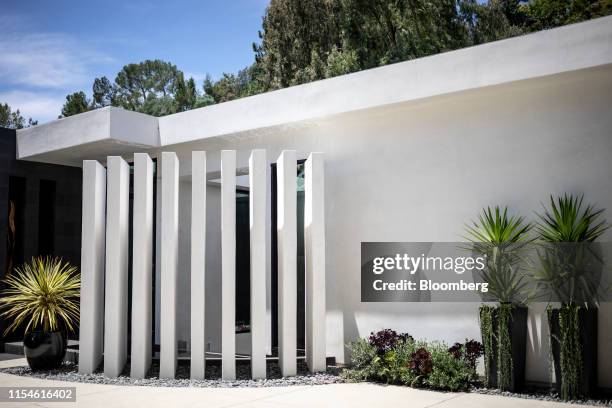 The exterior of a house for sale is seen at 1049 Loma Vista Drive in the Trousdale neighborhood of Beverly Hills, California, U.S., on Saturday, June...