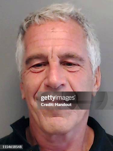 In this handout provided by the Florida Department of Law Enforcement, Jeffrey Epstein poses for a sex offender mugshot after being charged with...