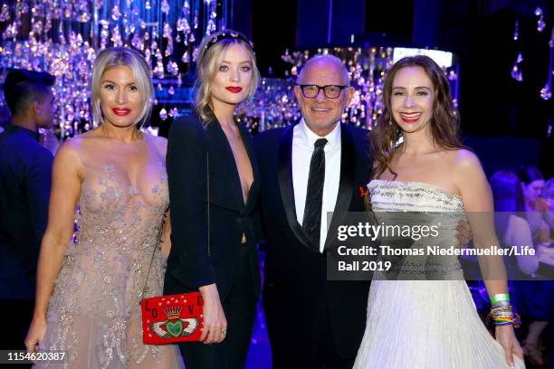 Hofit Golan, Laura Whitmore, Bill Roedy and Alexandra Roedy attend the LIFE+ Solidarity Gala prior to the Life Ball 2019 at Spiegelzelt in the City...