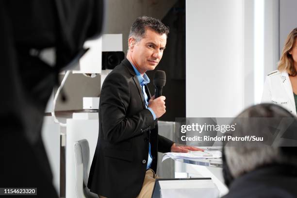 Journalist Laurent Luyat poses at "France Televisions" french chanel studio during the 2019 French Tennis Open - Day Fourteen at Roland Garros on...