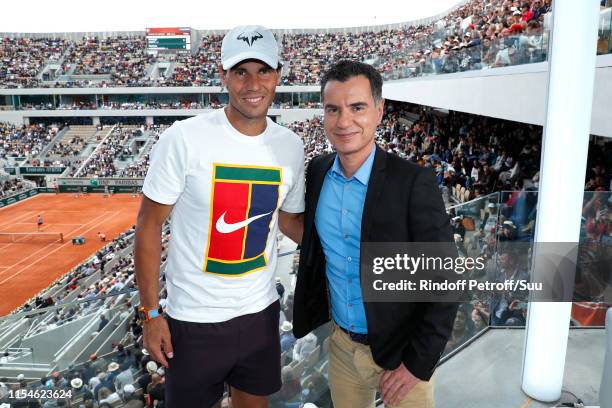 Tennis player Rafael Nadal and journalist Laurent Luyat pose at "France Televisions" french chanel studio during the 2019 French Tennis Open - Day...