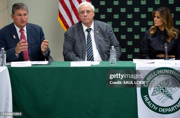 First Lady Melania Trump , West Virginia Governor Jim Justice and US Senator Joe Manchin , Democrat of West Virginia, attend a roundtable discussion...