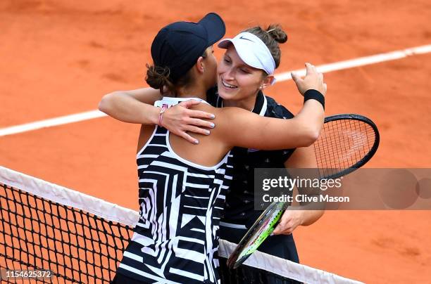 Ashleigh Barty of Australia embraces Marketa Vondrousova of The Czech Republic following victory in the ladies singles final during Day fourteen of...