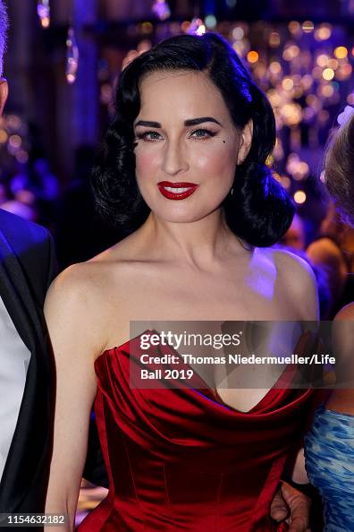 Dita Von Teese, wearing Lena Hoschek, attends the LIFE+ Solidarity