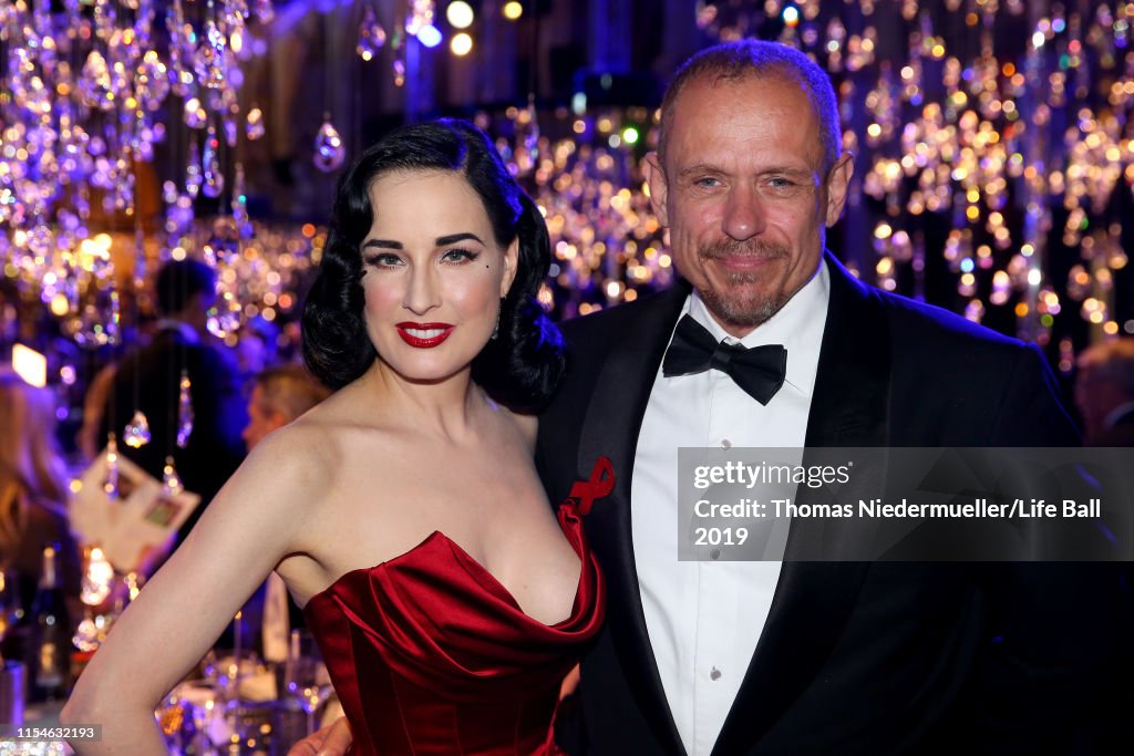 Dita Von Teese , wearing Lena Hoschek, and Gery Keszler attend the