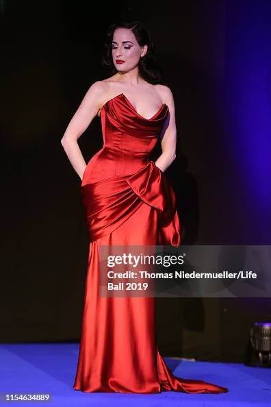 Dita Von Teese wearing dress by Lena Hoschek attends the LIFE+... News