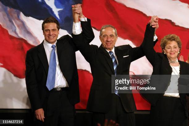 November 7, 2006: MANDATORY CREDIT Bill Tompkins/Getty Images Andrew Cuomo, Mario Cuomo and Matilda Cuomo raise their hands in celebration during the...