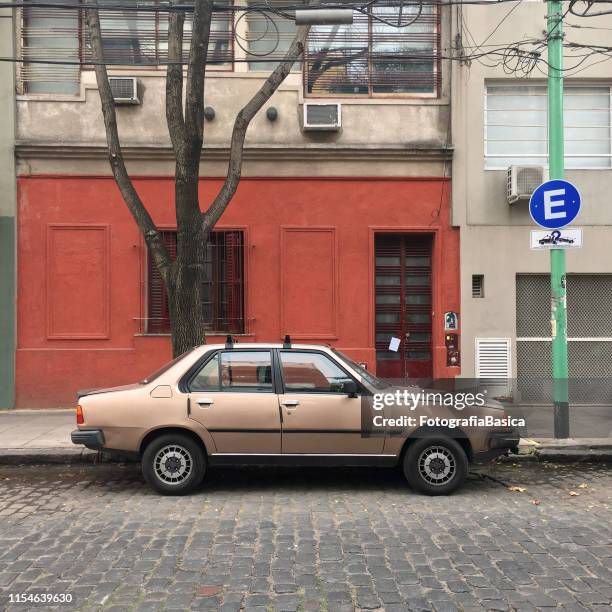 vintage car parked in the street - old renault stock pictures, royalty-free photos & images