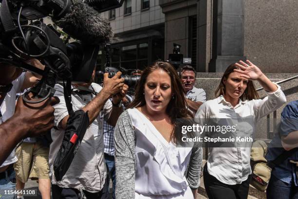 Two of Jeffrey Epstein's alleged victims, Michelle Licata and Courtney Wild , exit the courthouse after a hearing about the billionaire financier on...