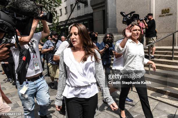 Two of Jeffrey Epstein's alleged victims, Michelle Licata and Courtney Wild , exit the courthouse after a hearing about billionaire financier Jeffery...