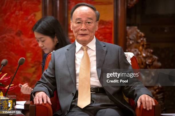 Chinese Vice President Wang Qishan speaks during a meeting with Malaysia's Deputy Prime Minister Wan Azizah Wan Ismail at the Zhongnanhai Leadership...