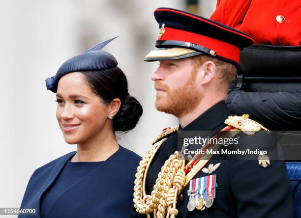 Meghan, Duchess of Sussex and Prince Harry, Duke of Sussex travel down The Mall in a horse drawn carriage during Trooping The Colour, the Queen's...