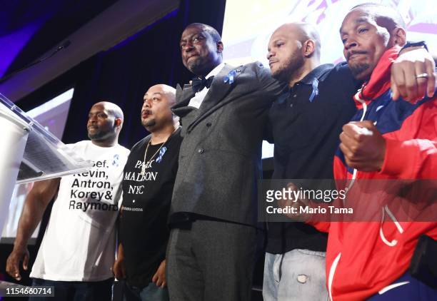 Honorees Antron McCray, Raymond Santana, Yusef Salaam, Kevin Richardson and Korey Wise embrace on stage at the American Civil Liberties Union of...