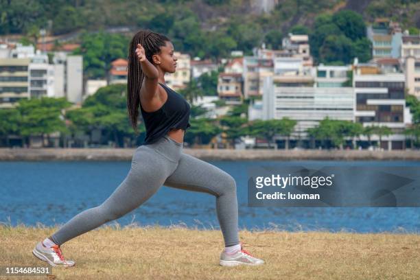 brazilian black woman making exercise outside - flamengo park stock pictures, royalty-free photos & images