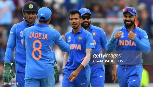 India's Yuzvendra Chahal celebrates with teammates after the dismissal of New Zealand's captain Kane Williamson during the 2019 Cricket World Cup...