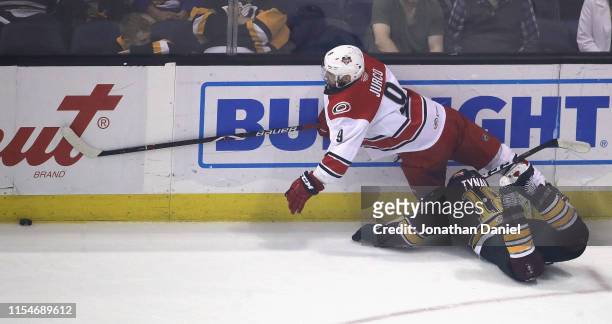 Tomas Jurco of the Charlotte Checkers falls over T.J. Tynan of the Chicago Wolves during game Five of the Calder Cup Finals at Allstate Arena on June...