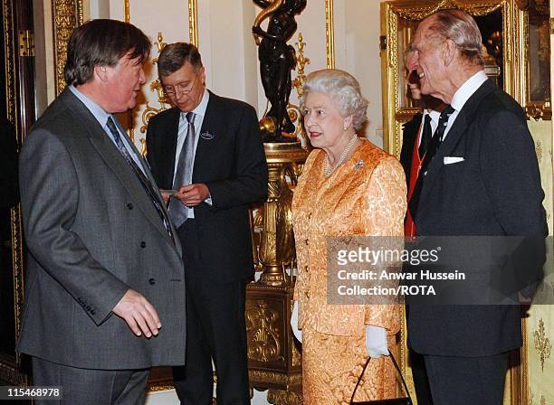 Queen Elizabeth II and Prince Philip, Duke of Edinburgh meet former Chancellor Kenneth Clarke at a Buckingham Palace reception for backbench MPs on...