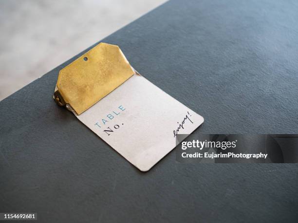 close up of restaurant memo paper on dark background - paper clip stockfoto's en -beelden