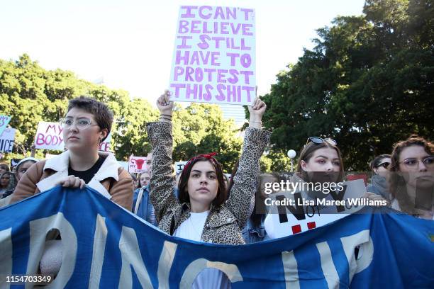 Young women hold protest signs during a rally for reproductive rights at Hyde Park on June 09, 2019 in Sydney, Australia. The march was organised by...