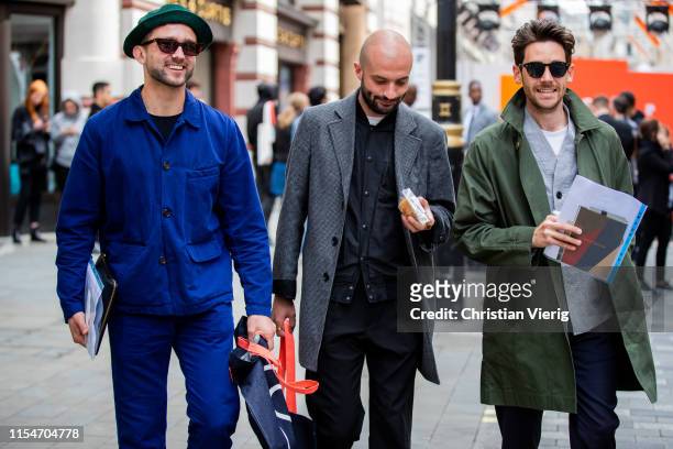 Finlay Renwick, a guest and Charlie Teasdale seen outside St James's during London Fashion Week Men's June 2019 on June 08, 2019 in London, England.