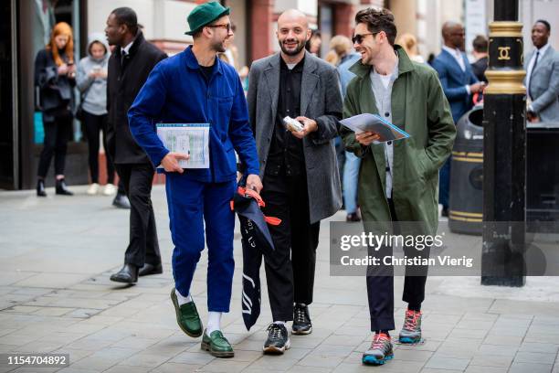 Finlay Renwick, a guest and Charlie Teasdale seen outside St James's during London Fashion Week Men's June 2019 on June 08, 2019 in London, England.