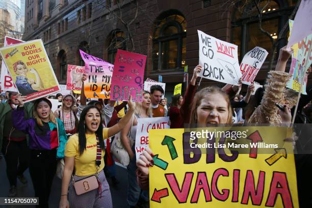 Young women hold protest signs and chant during a rally for reproductive rights on June 09, 2019 in Sydney, Australia. The march was organised by a...