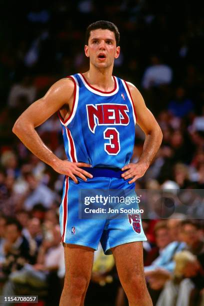 Drazen Petrovic of the New Jersey Nets looks on during the game against the LA Clippers on March 7, 1990 at the Brendan Byrne Arena in East...