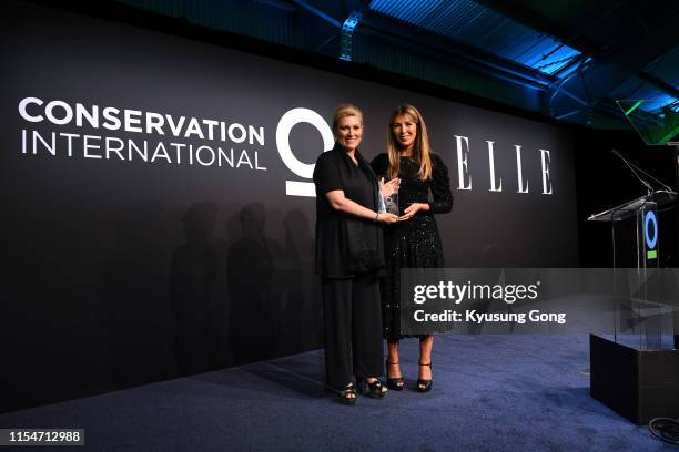 Marie Claire Daveu and Elle editor-in-chief Nina Garcia onstage at the Conservation International + ELLE Los Angeles Gala at Milk Studios on June 08,...