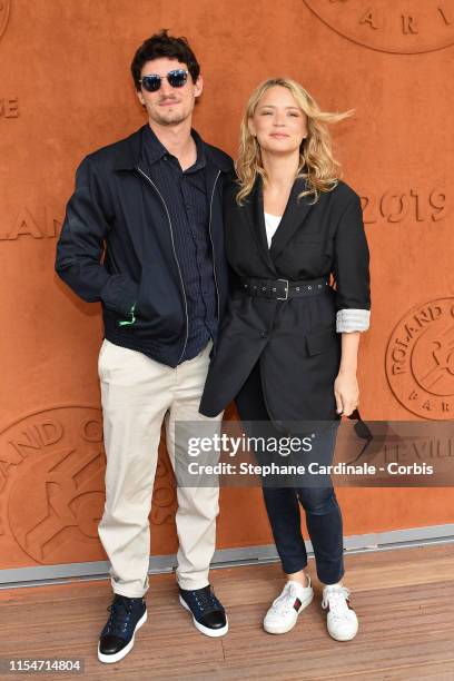 Virginie Efira and her companion Niels Schneider attend the 2019 French Tennis Open - Day Fourteen at Roland Garros on June 08, 2019 in Paris, France.