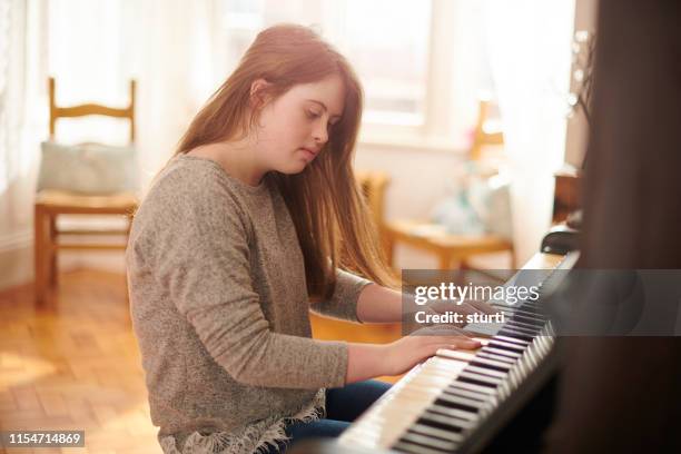 teenager at the piano - keyboard musical instrument child stock pictures, royalty-free photos & images