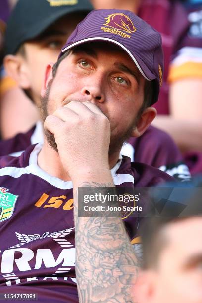 Broncos fan reacts during the round 13 NRL match between the Brisbane Broncos and the Gold Coast Titans at Suncorp Stadium on June 09, 2019 in...