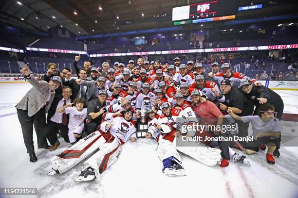 Members of the Charlotte Checkers celebrate after a win against the Chicago Wolves during game Five of the Calder Cup Finals at Allstate Arena on...