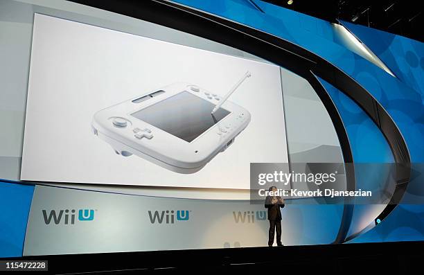 Satoru Iwata, Global President, Nintendo Co., Ltd., speaks during a news conference after the unveiling of the new game console Wii U at the...