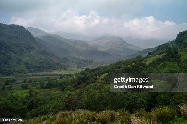 View over hills in the Snowdonia National Park on June 24, 2019 in Beddgelert, North Wales.