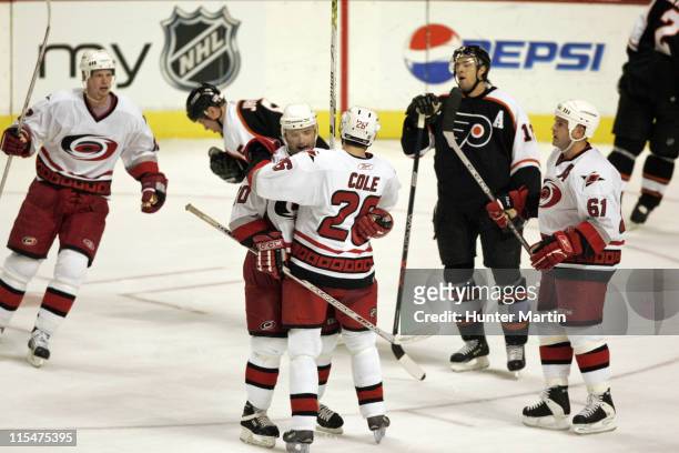 Hurricanes defenseman Oleg Tverdovsky is congratulated by teammate Erik Cole after scoring a third period game tying goal at the Wachovia Center in...