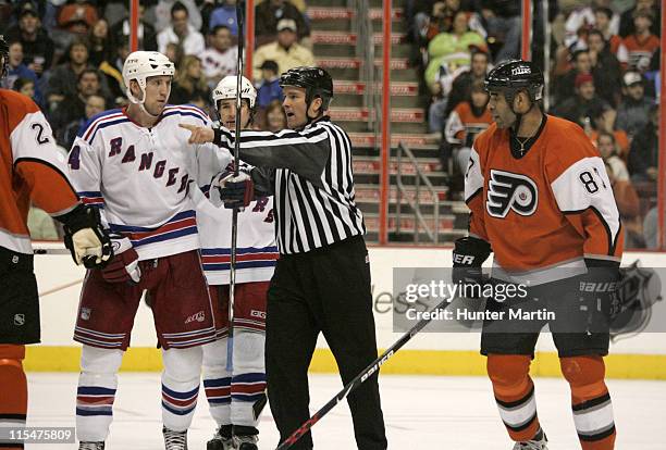 Rangers right winger Jason Ward is separated from Flyers defenseman Donald Brashear at the Wachovia Center in Philadelphia, Pa. On Saturday, February...