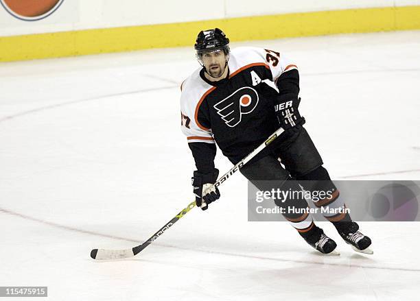 Flyers defenseman Eric Desjardins , in his first game of the season, skates up ice at the Wachovia Center in Philadelphia, Pa. On Wednesday, February...