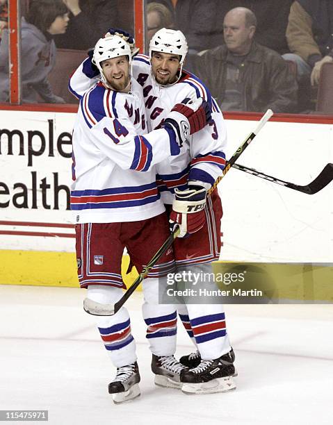 New York Rangers right winger Jason Ward is congratulated by teammate Michal Rozsival after scoring a goal at the Wachovia Center in Philadelphia,...