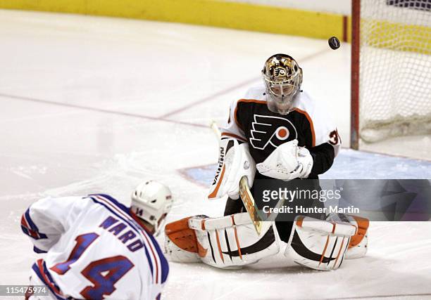 Philadelphia Flyers goalie Antero Niittymaki makes a third period save against New York Rangers right winger Jason Ward at the Wachovia Center in...