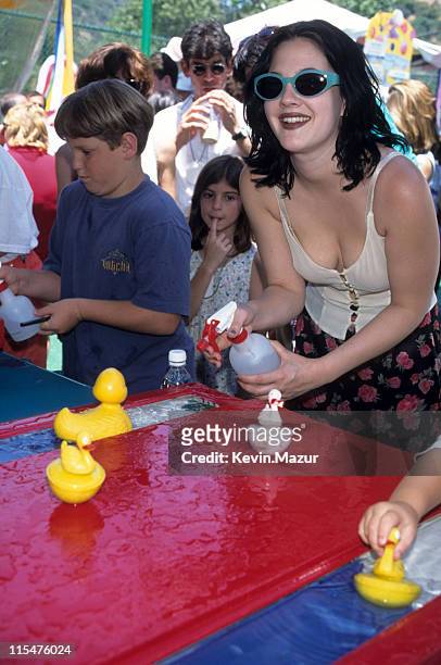 Drew Barrymore during 1996 ""Kids for Kids"" Carnival Elizabeth Glasser Pediatric Aids Foundation Fundraiser at Industria Studio in New York City,...