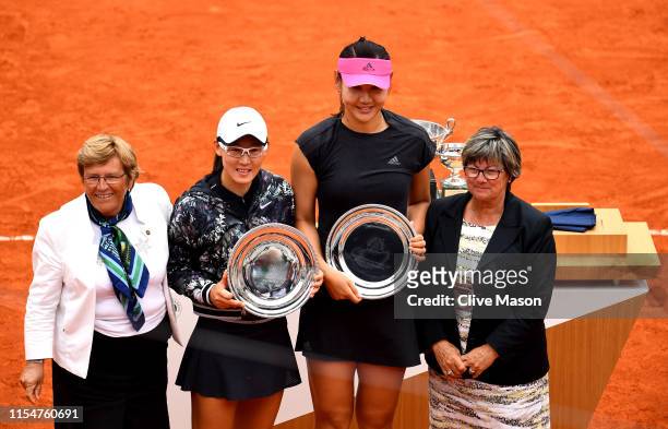 Runners up, Yingying Duan of China and partner Saisai Zheng of China pose with their trophies following the ladies doubles final against Timea Babos...