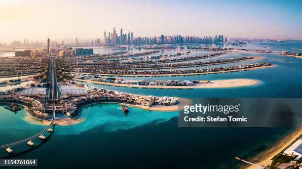 the palm island panorama with dubai marina in the background aerial - dubai stock pictures, royalty-free photos & images