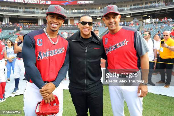 Francisco Lindor and manager Alex Cora of the American League All-Stars pose for a picture with Daddy Yankee during the Gatorade All-Star Workout Day...