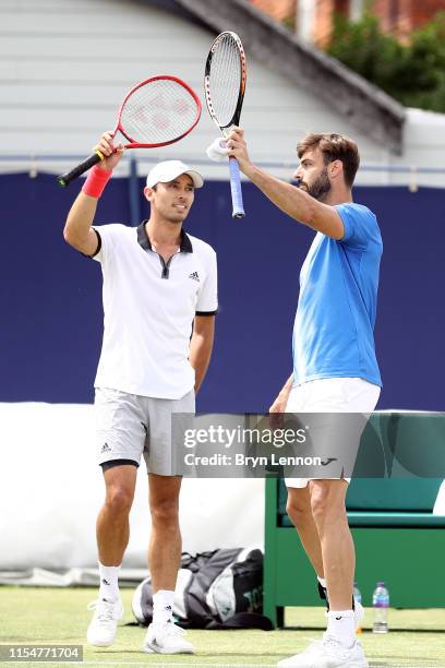 Marcel Granollers of Spain and Ben McLachlan of Japan celebrate winning the Men's Doubles Final during the Women's Single Final at Surbiton Racquet &...