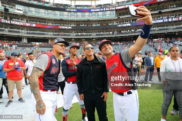 Javier Baez of the National League All-Stars Francisco Lindor and coach Ramon Vazquez of the American League All-Stars pose for a picture with Daddy...